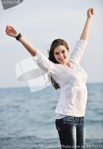 Image of young woman enjoy on beach