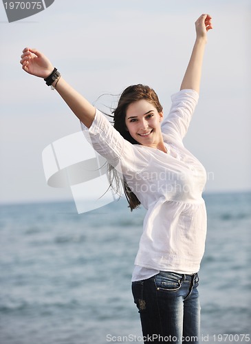 Image of young woman enjoy on beach