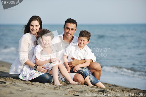 Image of happy young family have fun on beach