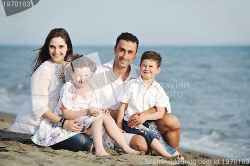 Image of happy young family have fun on beach