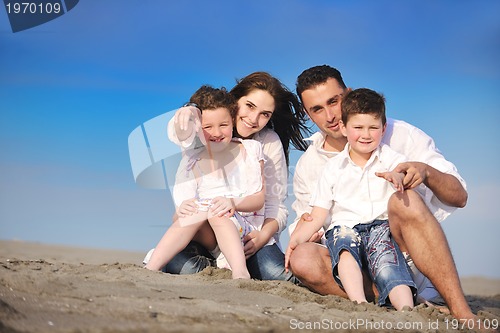 Image of happy young family have fun on beach