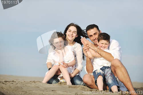 Image of happy young family have fun on beach