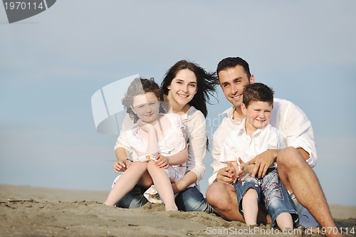 Image of happy young family have fun on beach