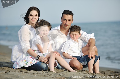 Image of happy young family have fun on beach