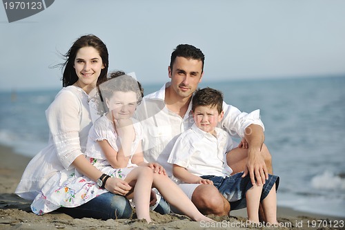 Image of happy young family have fun on beach