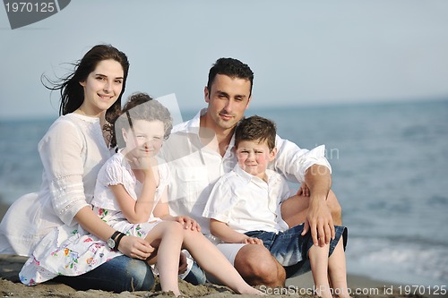 Image of happy young family have fun on beach