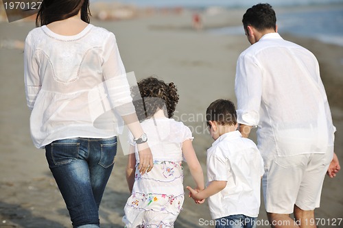 Image of happy young family have fun on beach