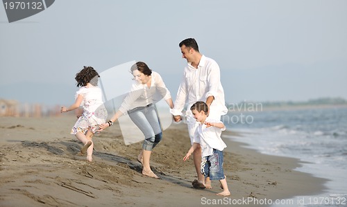 Image of happy young family have fun on beach