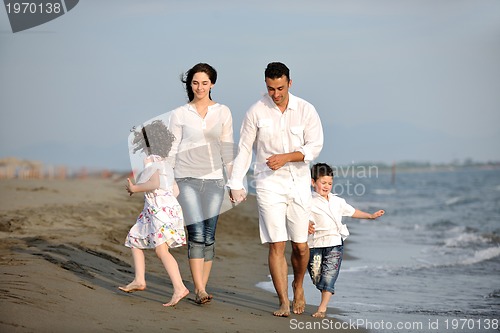 Image of happy young family have fun on beach