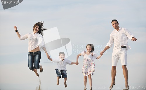 Image of happy young family have fun on beach
