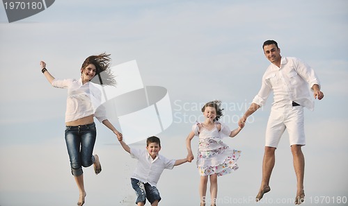 Image of happy young family have fun on beach
