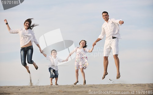 Image of happy young family have fun on beach