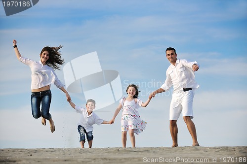 Image of happy young family have fun on beach