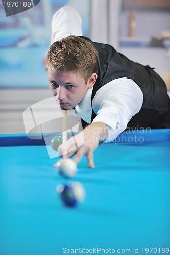 Image of young man play pro billiard game 