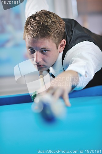 Image of young man play pro billiard game 