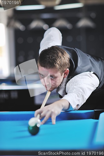 Image of young man play pro billiard game 