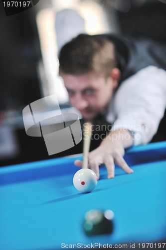 Image of young man play pro billiard game 