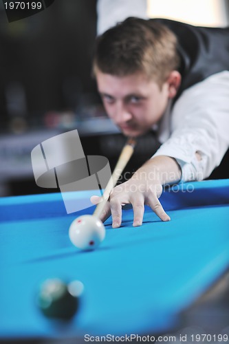 Image of young man play pro billiard game 