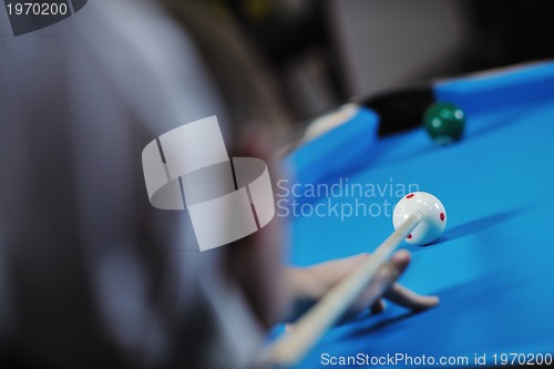 Image of young man play pro billiard game 