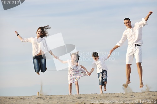 Image of happy young family have fun on beach