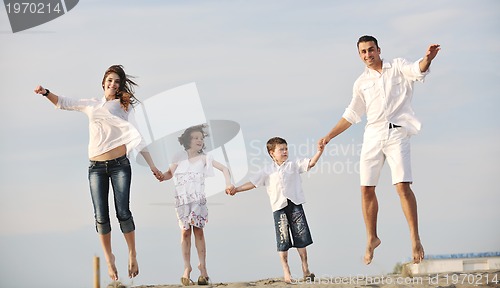 Image of happy young family have fun on beach