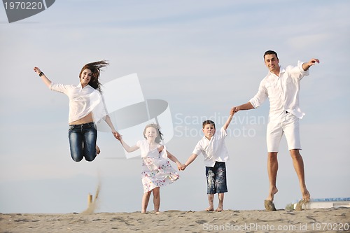 Image of happy young family have fun on beach