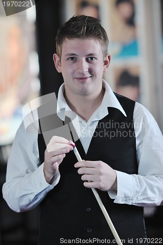 Image of young man play pro billiard game 