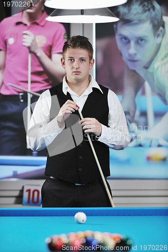 Image of young man play pro billiard game 