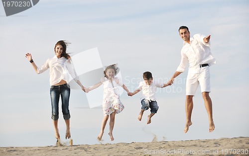 Image of happy young family have fun on beach