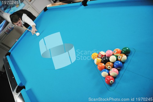 Image of young man play pro billiard game 