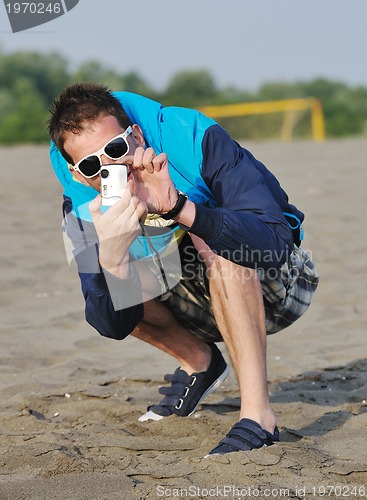 Image of amateur photographer taking snapshot photo