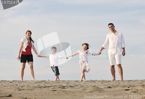 Image of happy young family have fun on beach
