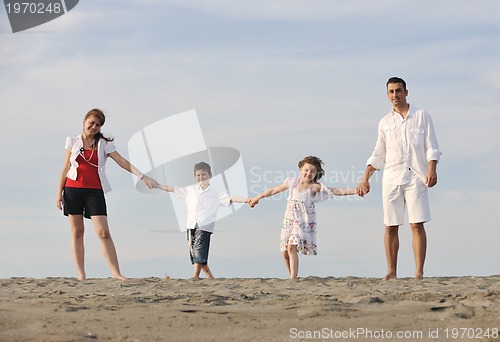 Image of happy young family have fun on beach