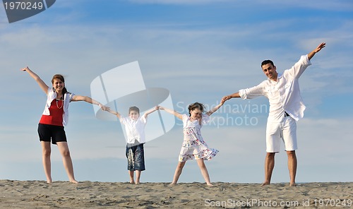 Image of happy young family have fun on beach