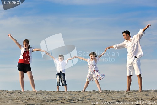 Image of happy young family have fun on beach