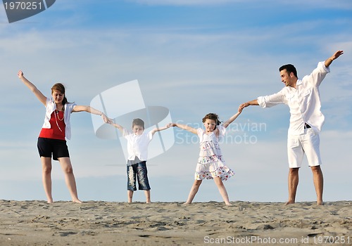Image of happy young family have fun on beach