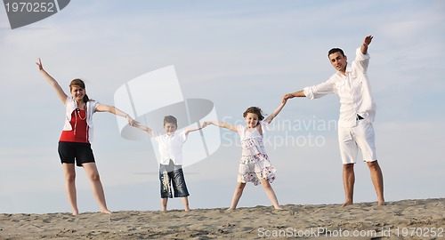 Image of happy young family have fun on beach