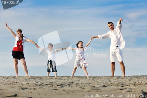 Image of happy young family have fun on beach