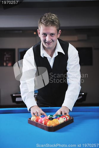 Image of young man play pro billiard game 