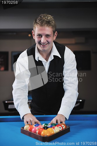 Image of young man play pro billiard game 