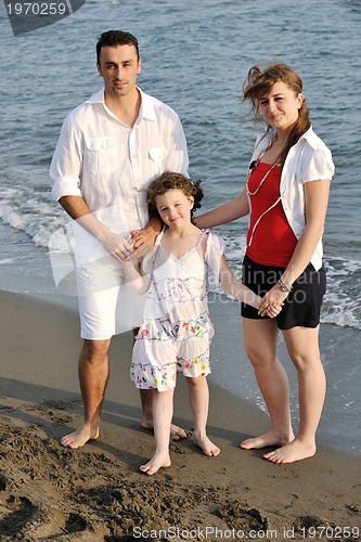 Image of happy young family have fun on beach