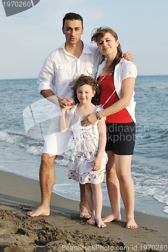 Image of happy young family have fun on beach