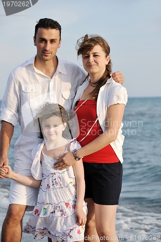 Image of happy young family have fun on beach