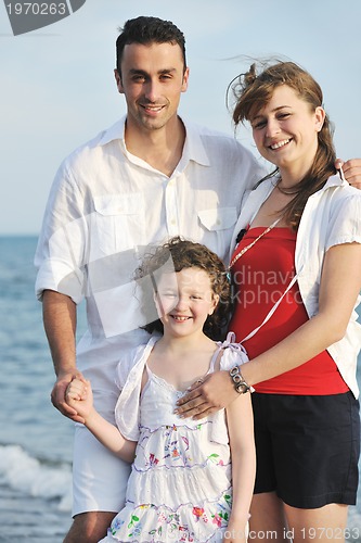 Image of happy young family have fun on beach