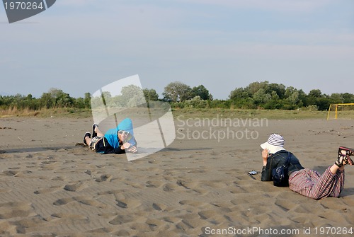 Image of happy young couple have fun on beach