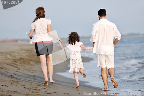 Image of happy young family have fun on beach