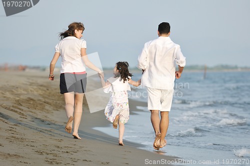 Image of happy young family have fun on beach