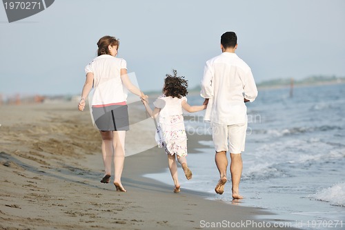 Image of happy young family have fun on beach