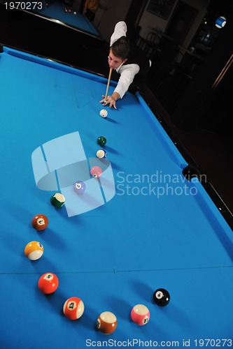 Image of young man play pro billiard game 