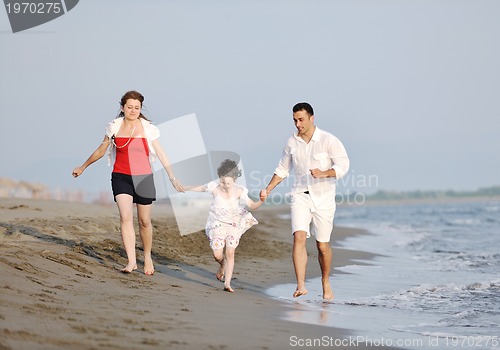 Image of happy young family have fun on beach